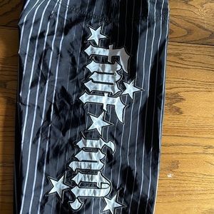 Men’s board shorts. Black with white stripes. Size 36. EUC